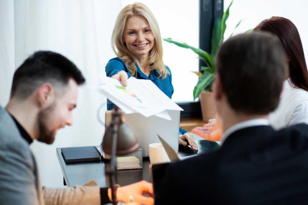 Friendly accountant presenting financial reports during a client meeting, highlighting expert cpa fort lauderdale accounting services