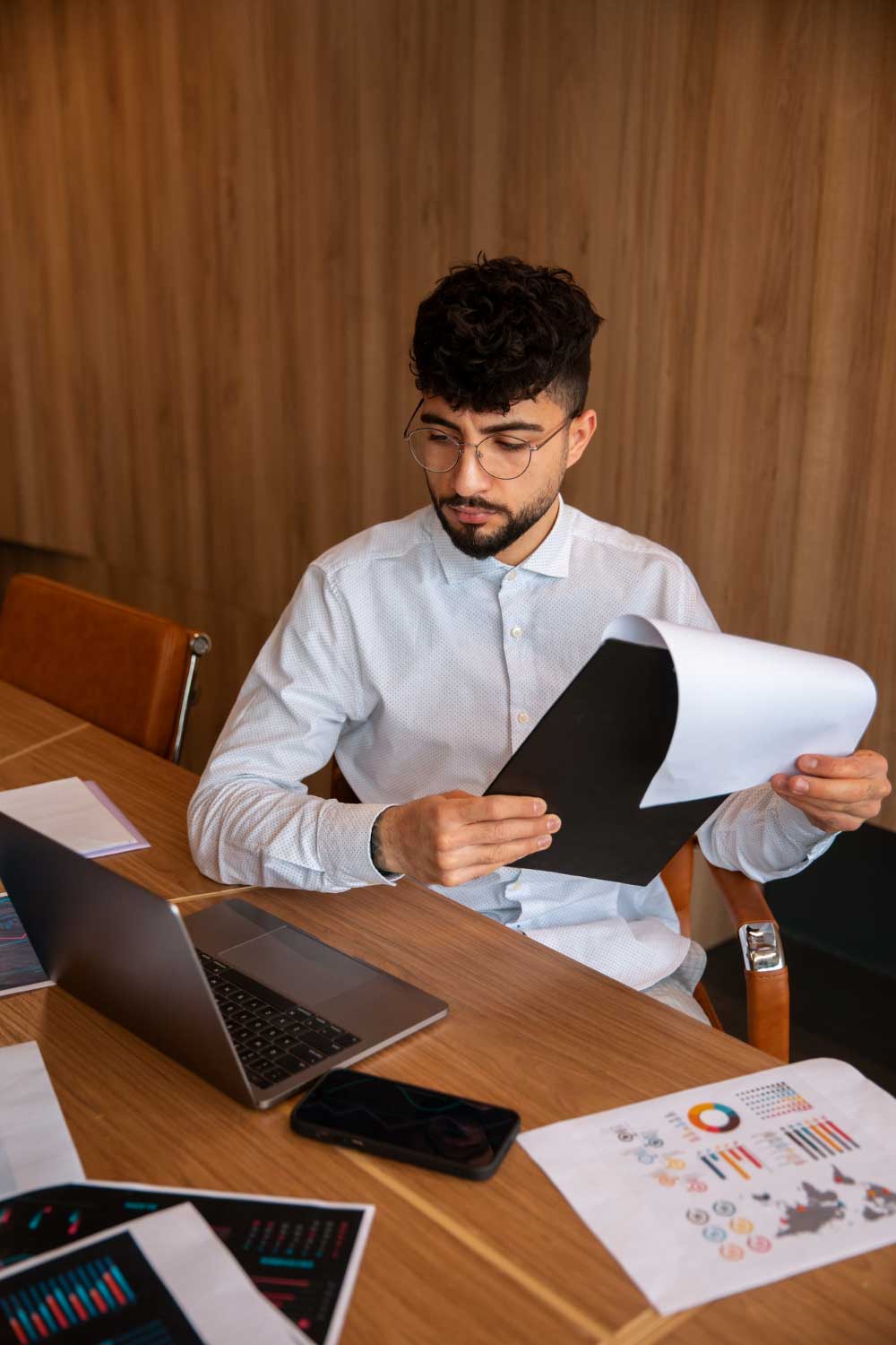 account-2 Professional accountant reviewing financial documents and reports at a modern office of a trusted CPA Miami FL accounting and tax advisory firm