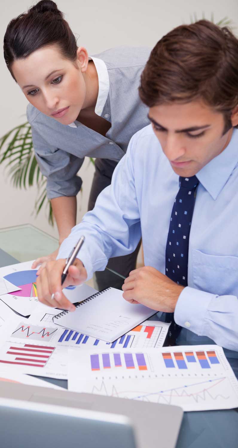 account-4 Professional accountants reviewing financial reports and charts during client consultation at a trusted CPA Miami FL accounting and financial advisory firm