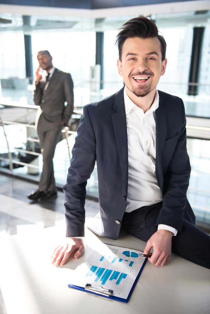 business-financial-consultant-3 Smiling financial professional reviewing charts in a modern office, showcasing reliable bookkeeping services Fort Lauderdale for businesses