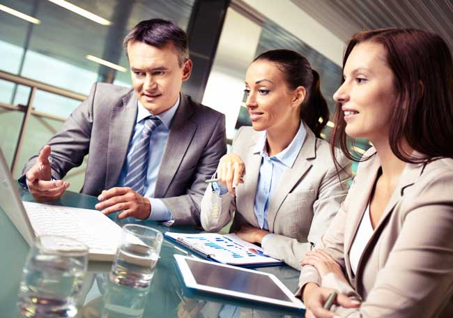 cpa-4 Business professionals collaborating on financial reports in a modern office meeting, showcasing expert cpa boca raton accounting services