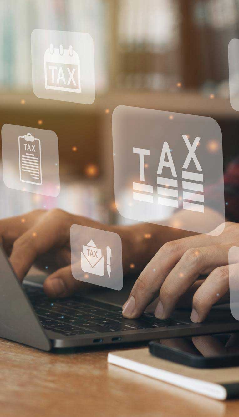 tab-pre-3-1 Person typing on a laptop with digital TAX icons, calendar, documents, and financial symbols floating above the keyboard, representing online tax filing and financial management services, Tax Preparation Miami